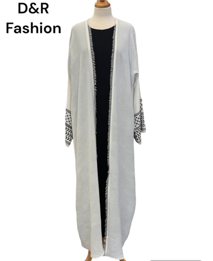 Elegant white abaya with black design on the cuffs