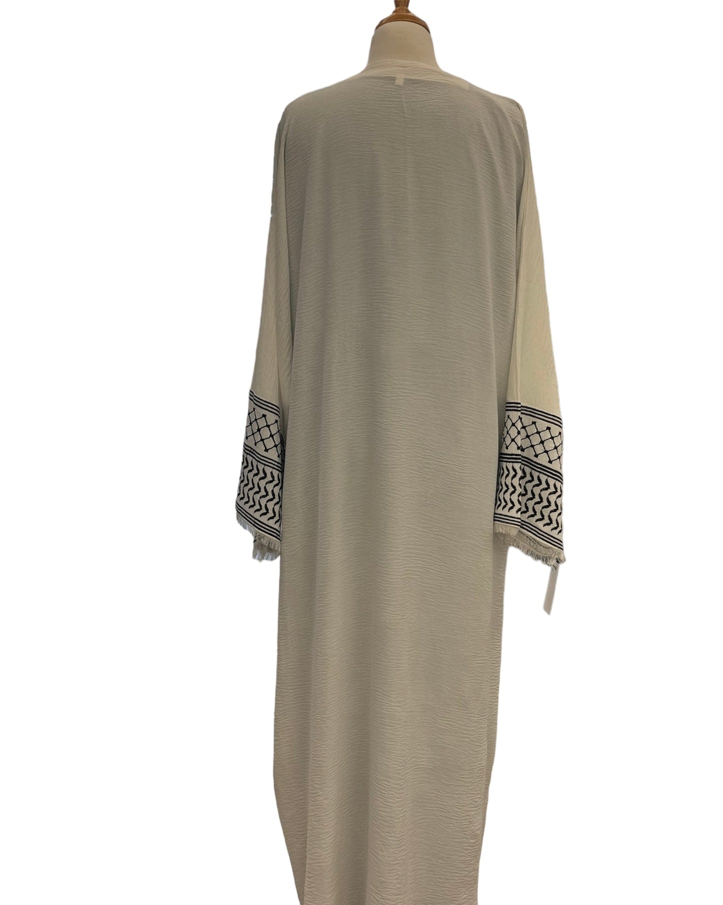 Elegant white abaya with black design on the cuffs