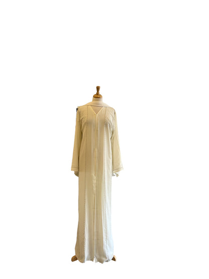 Discover our transparent off-white Dubai abaya, adorned with bead embroidery